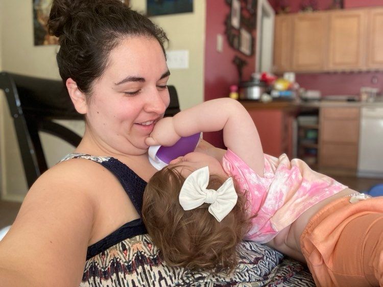 woman playing with her baby